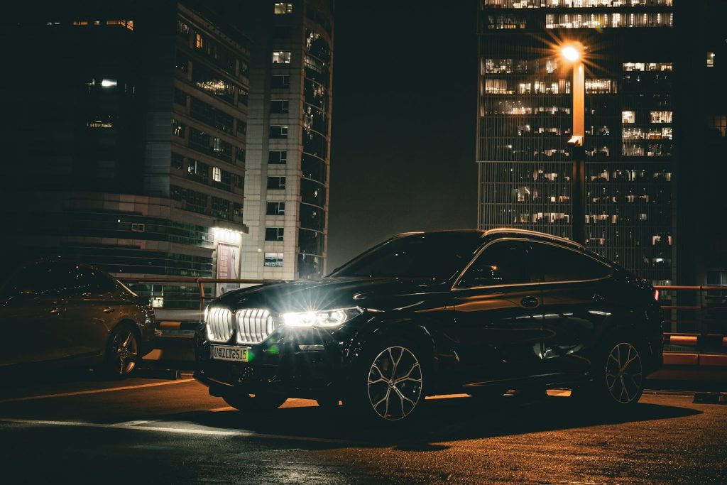 black bmw suv night city
