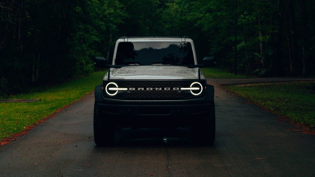 white ford bronco on road